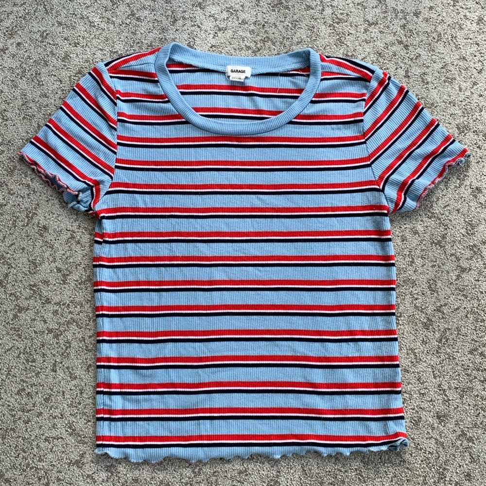 Light blue, red,and white tee-shirt from garage
